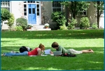 Students study on the quad, soaking up the sunny weather.